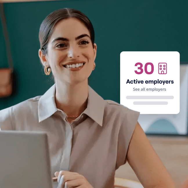 A smiling woman sits at a laptop in a modern office with a green background, while an overlay displays “30 active employers” with a link to see all employers.